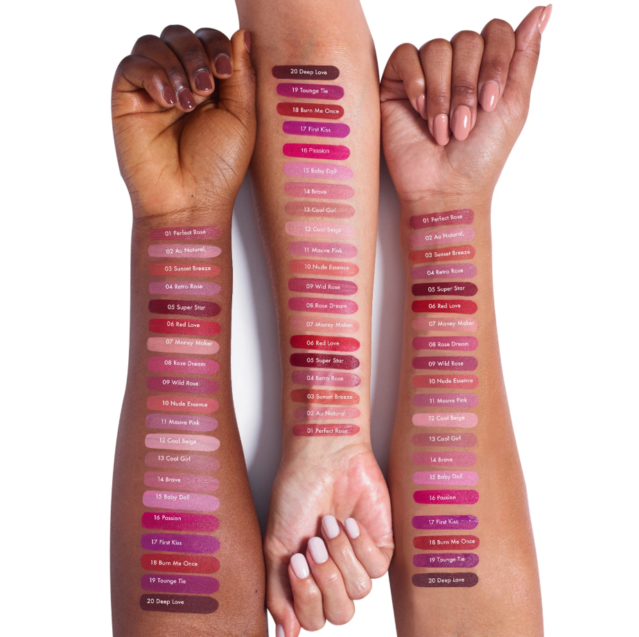 Three arms with different skin tones displaying a range of lip swatches on a white background.